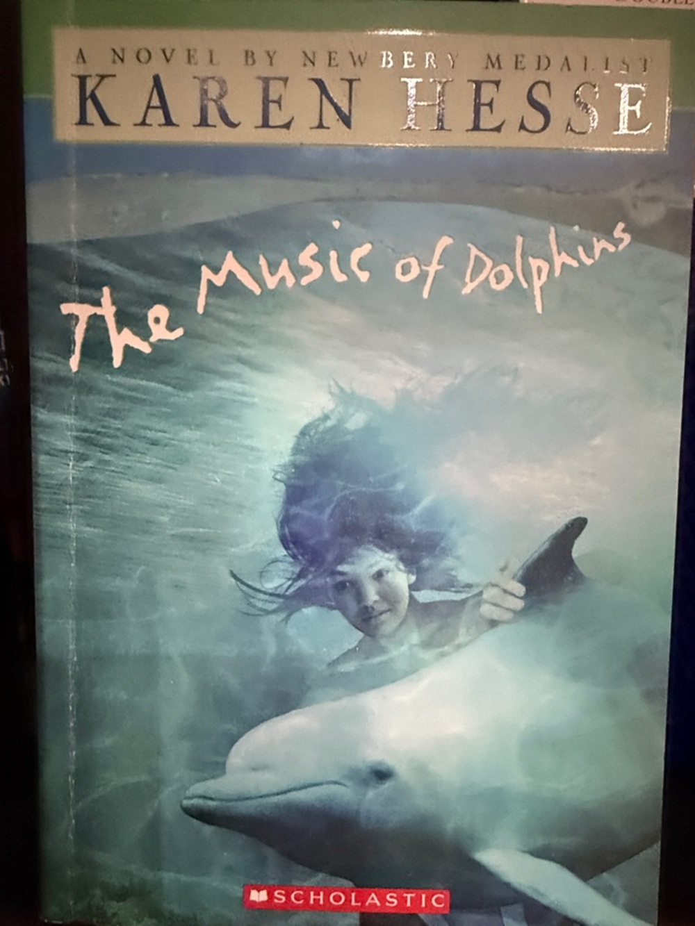 Scholastic Turquoise-Aqua Cover: The Music of Dolphins-A novel by Newbery Medali